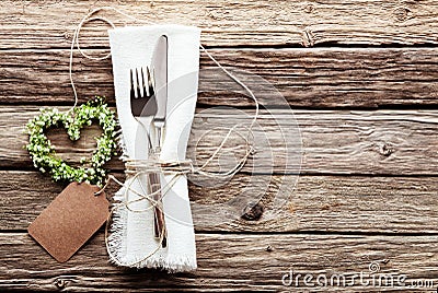 Heart Shaped Wedding Wreath at Rustic Table Setting Stock Photo