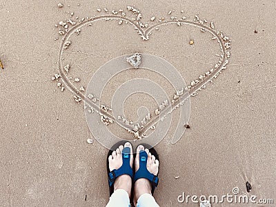 The rectangle shaped is written by hand in the sand Stock Photo