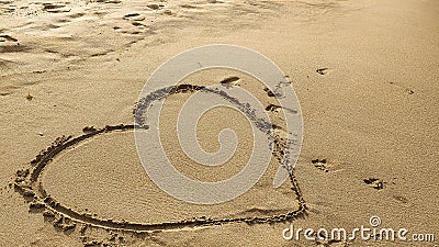heart simbol on beach sand Stock Photo