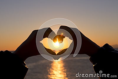 Heart at sunset Stock Photo