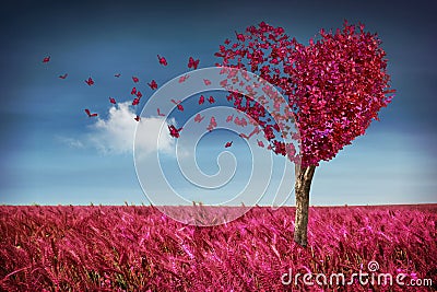 Heart tree with butterflies and meadow Stock Photo