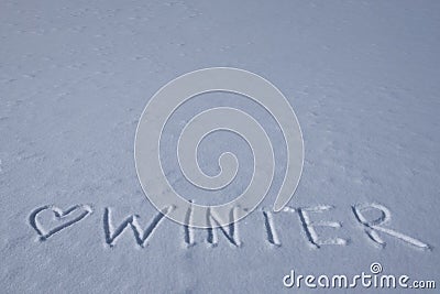 Heart and winter inscription on a fresh snow Stock Photo