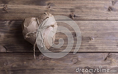 Heart wrapped in brown kraft paper Stock Photo