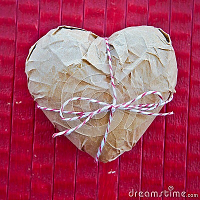 Heart wrapped in Paper Stock Photo