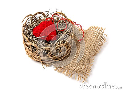 Heart of yarn in a wicker basket Stock Photo