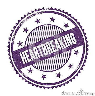 HEARTBREAKING text written on purple indigo grungy round stamp Stock Photo