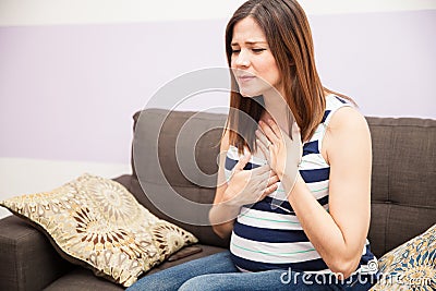 Heartburn during pregnancy Stock Photo