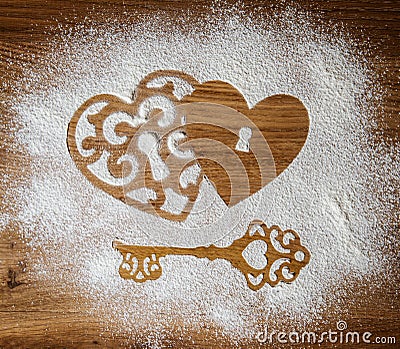 Hearts and a key of the flour as a symbol of love on wooden background. Valentines day background. Vintage retro card. Stock Photo