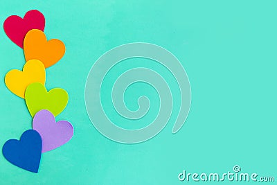 Hearts in lgbtq colors on green mint background Stock Photo