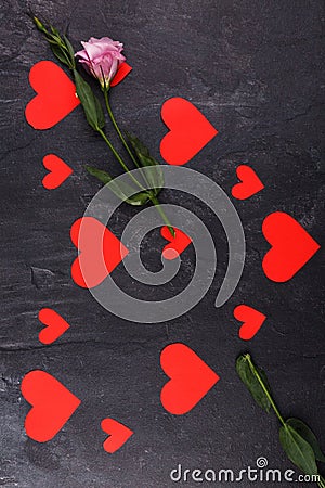 The hearts are lined up in one big heart lying vertically with Japanese roses on a stone background Stock Photo