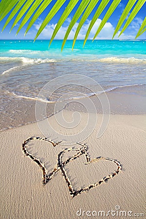 Hearts in love written in Caribbean beach sand Stock Photo