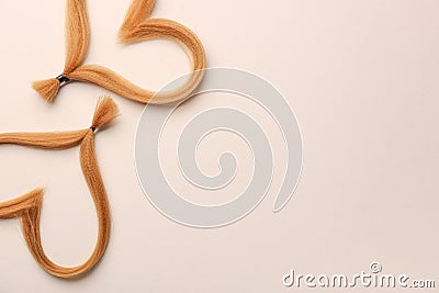 Hearts made of hair strands on light background. Concept of donation Stock Photo