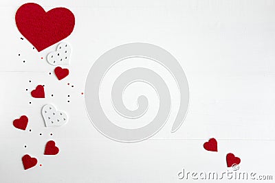 Hearts on a white wooden background. Background for Valentine`s Day. Background for a banner with hearts for girls. Card Stock Photo
