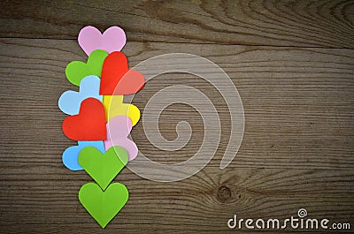 Hearts on Wooden Texture. Valentines Day background Stock Photo