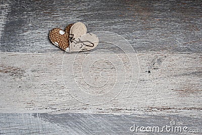 Hearts on worn wood Stock Photo