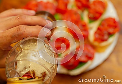 Hearty snack with different kinds of spreads on farmhouse bread served with a fresh yeast wheat beer Stock Photo