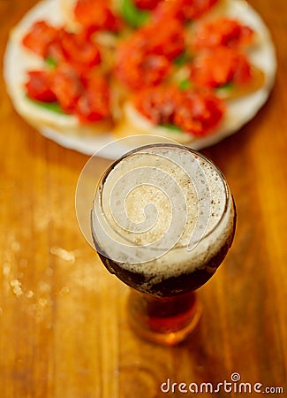 Hearty snack with different kinds of spreads on farmhouse bread served with a fresh yeast wheat beer Stock Photo