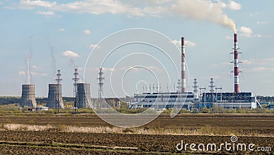 Heat Electric Station with the plowed field in the foreground Stock Photo