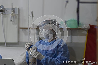 Heath Workers Inside COVID-19 ICU Editorial Stock Photo