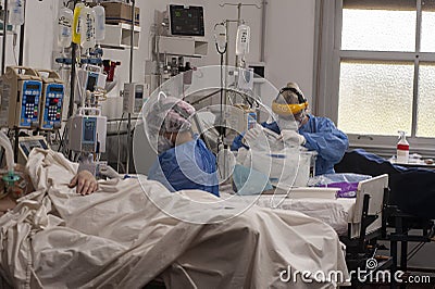 Heath Workers InsideCOVID-19 ICU Editorial Stock Photo