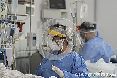 Heath Workers InsideCOVID-19 ICU Editorial Stock Photo