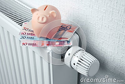 Heating battery with piggy bank Stock Photo