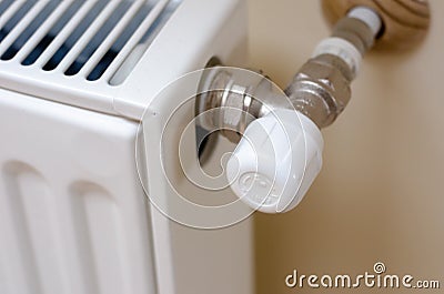 Heating radiator temperature adjustment. modern heating battery with thermostat Stock Photo