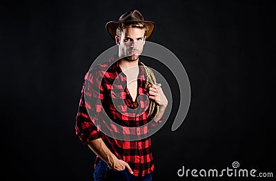 Heating up wild west. wild west rodeo. man in hat black background. man checkered shirt on ranch. Vintage style man Stock Photo