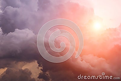 Heaven. Epic Dramatic storm cumulus clouds with yellow orange sun and sunlight Stock Photo