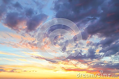 Heavenly summer background. Beautiful bright majestic dramatic evening sky at sunset or sunrise orange and blue with rays. The sun Stock Photo