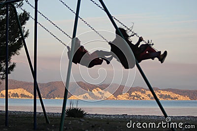 The Heavenly Swing of Happiness Stock Photo