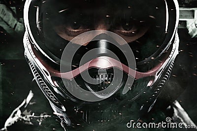 Heavily armed masked paintball soldier on post apocalyptic background. Ad concept. Stock Photo