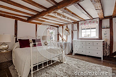 Heavily beamed bedroom in british home Editorial Stock Photo