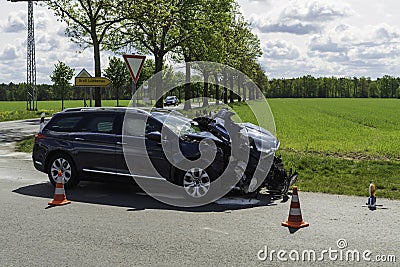 A heavily damaged car with front end damage Stock Photo