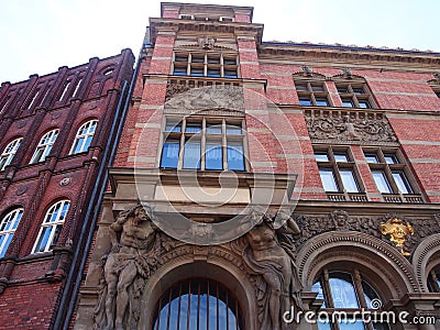 A heavily decorated classical buildings in gdansk, Poland red bricks, sculptures and arches Stock Photo