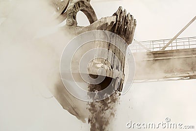 Heavy bucket of mining excavator with mechanical drive and flexible suspension of working equipment close-up Stock Photo