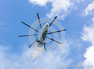 Heavy cargo helicopter flying against blue sky Stock Photo