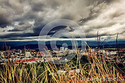 Heavy cloud hovering top of the small town. Stock Photo