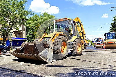 Heavy construction bulldozer and vibrating rollers during road construction Stock Photo