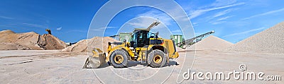 Heavy construction machine in open-cast mining - wheel loader tr Stock Photo