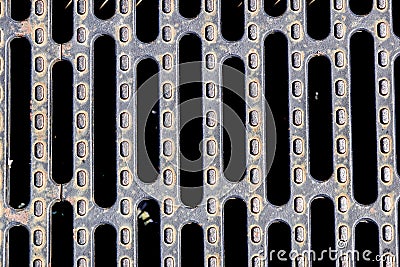 Heavy duty steel grating cover on sewer drain manhole Stock Photo