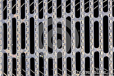 Heavy duty steel grating cover on sewer drain manhole Stock Photo