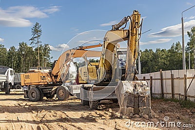 Heavy excavators at a construction site. Construction equipment for earthworks. Quarry excavator. Improvement of the territory and Stock Photo