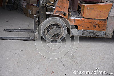 Heavy Forklift loader for warehouse works outdoors with risen forks . Stock Photo