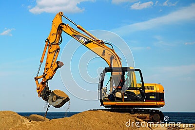 Replenishing the beach Editorial Stock Photo