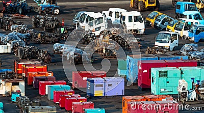 Heavy machinery second hand market. Old electric generator, tractor, diesel engine on dirty concrete floor. Warehouse of heavy Stock Photo