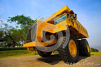 Heavy mining truck in mine and driving along the opencast. Photo of the big mine truck, The career heavy-load super car Stock Photo