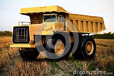 Heavy mining truck in mine and driving along the opencast. Photo of the big mine truck, The career heavy-load super car Stock Photo