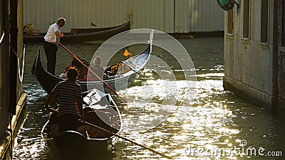 Heavy movement of gondolas with tourists, water traffic laws in Venice, Italy Editorial Stock Photo
