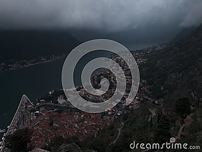 Heavy thunder clouds in Kotor harbour in Montenegro Stock Photo